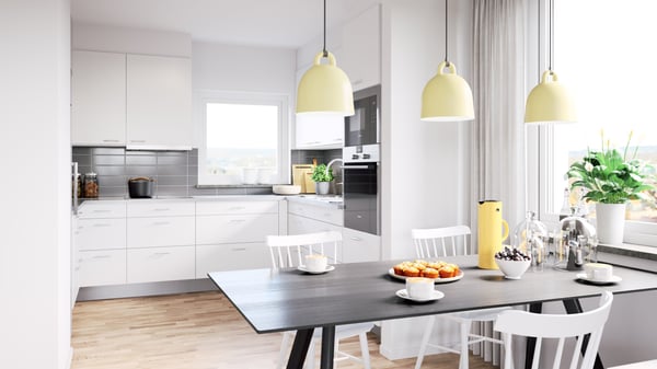 Inbjudande lägenhet med modernt vitt kök, matplats och ljusa pendellampor