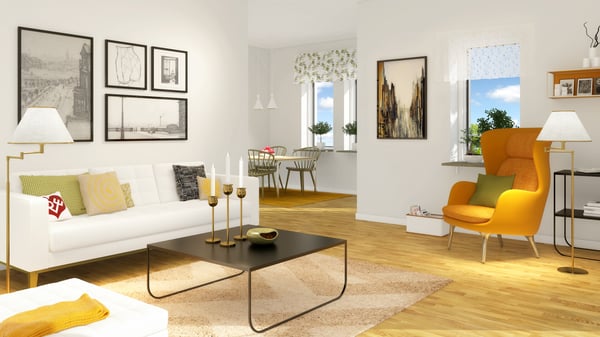 Vardagsrum med vit soffa, gul fåtölj och matplats i ljus, modern lägenhet