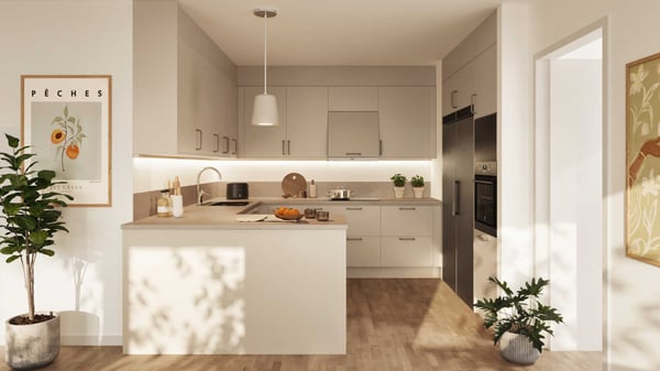 Lägenhet med modern köksö, ljusa skåp och integrerade vitvaror