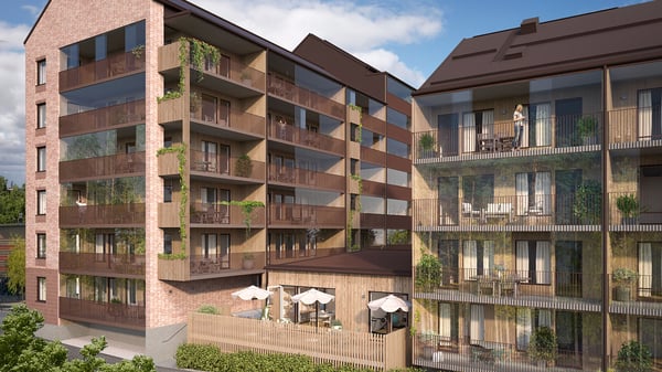 Bostadshus med balkonger och uteplats i ett modernt flerbostadskvarter